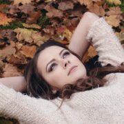 Woman pondering why fall leaves change color