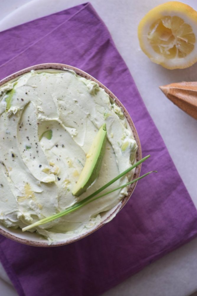 Avocado dip garnished with green onion