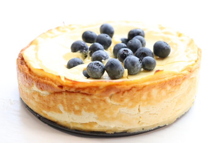 side view of zero point cheesecake with blueberries on top