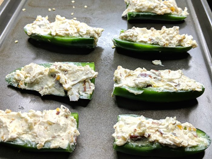 Chicken stuffed jalapeno poppers before baking 