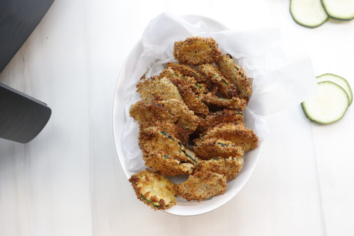 air fryer zucchini chips in a white bowl