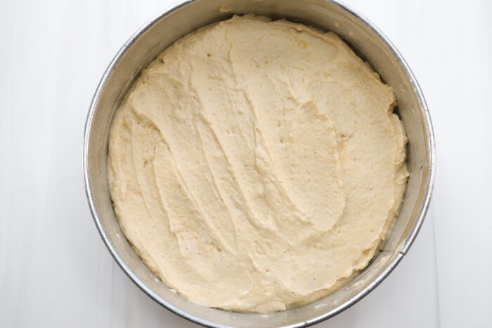 Pumpkin cheesecake mixture in a springform pan