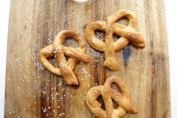 3 air fried pretzels on cutting board