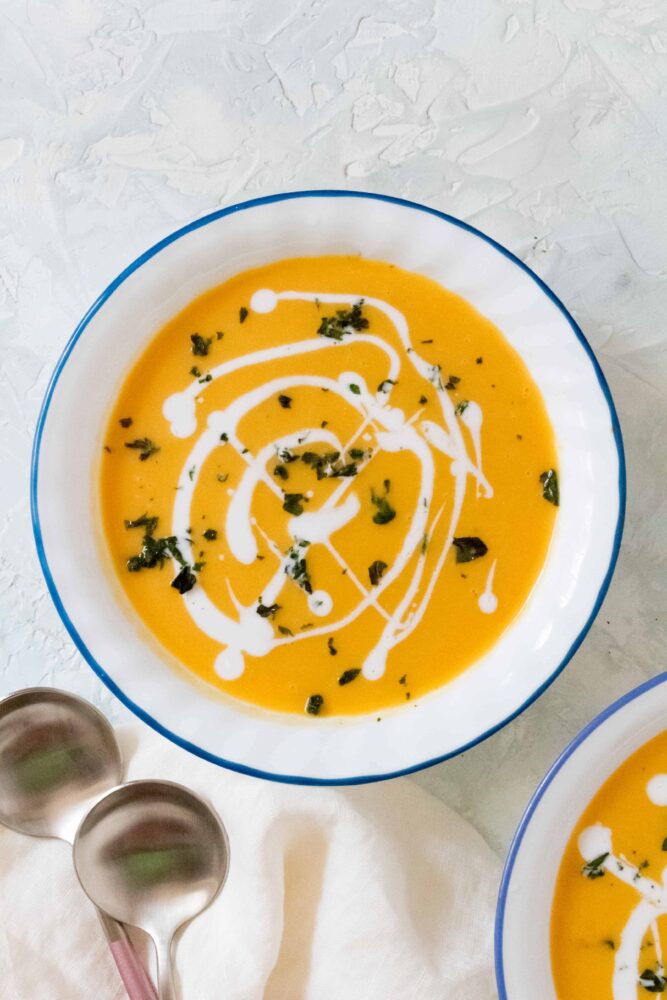 Instant pot thanksgiving thai carrot sweet potato soup in white bowl