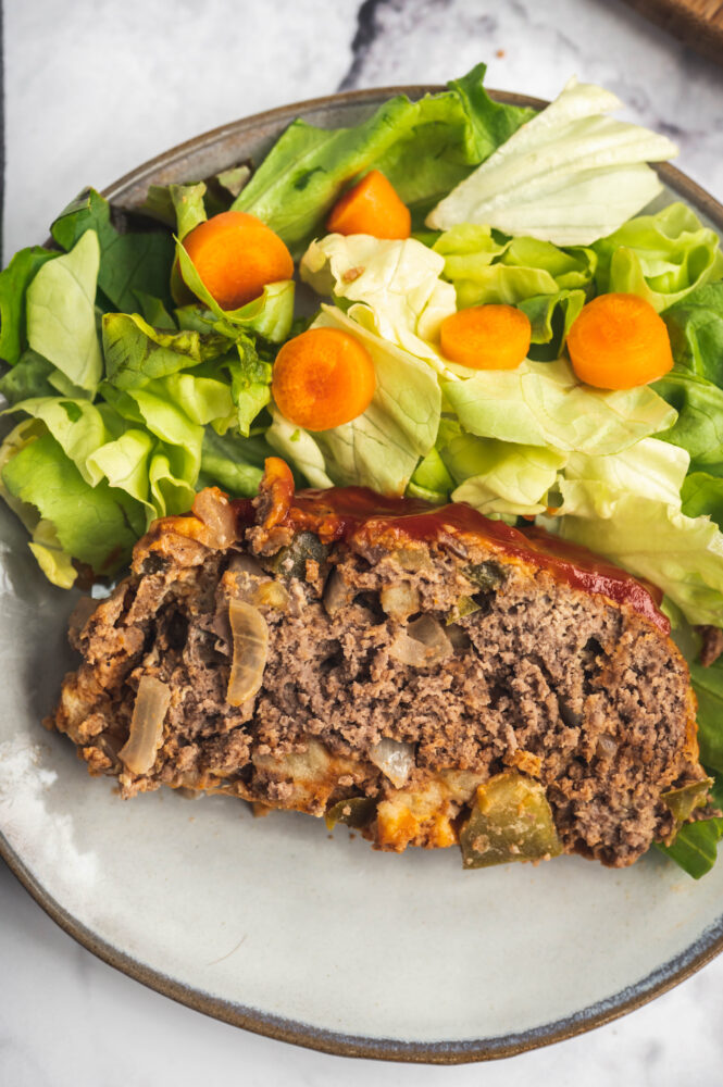 top view of instant pot meatloaf next to salad