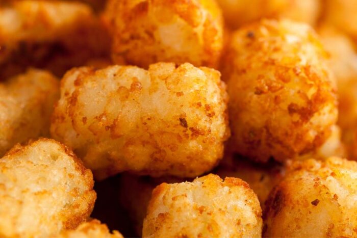 air fryer tater tots fresh out of the basket, close up
